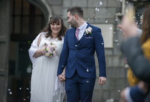 Photograph of Toby & Elizabeth Whittington celebrating their wedding in Norwich
